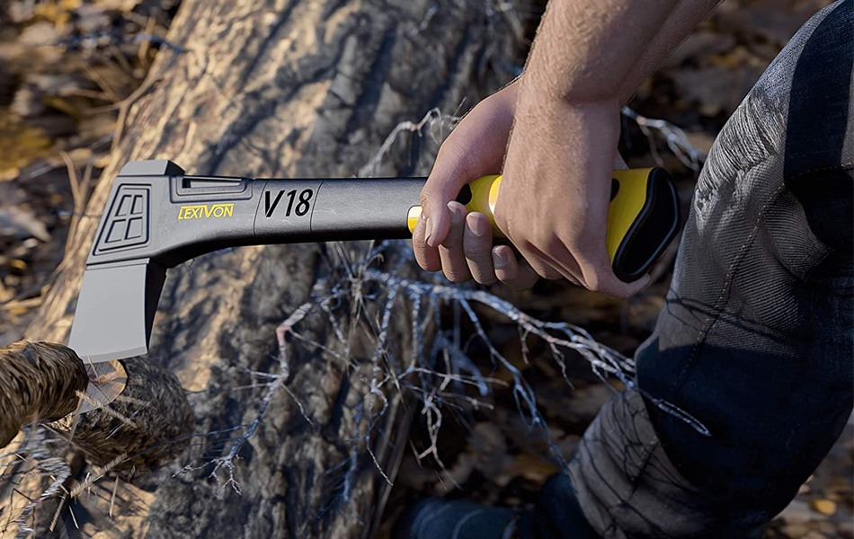 man using an axe for chopping wood